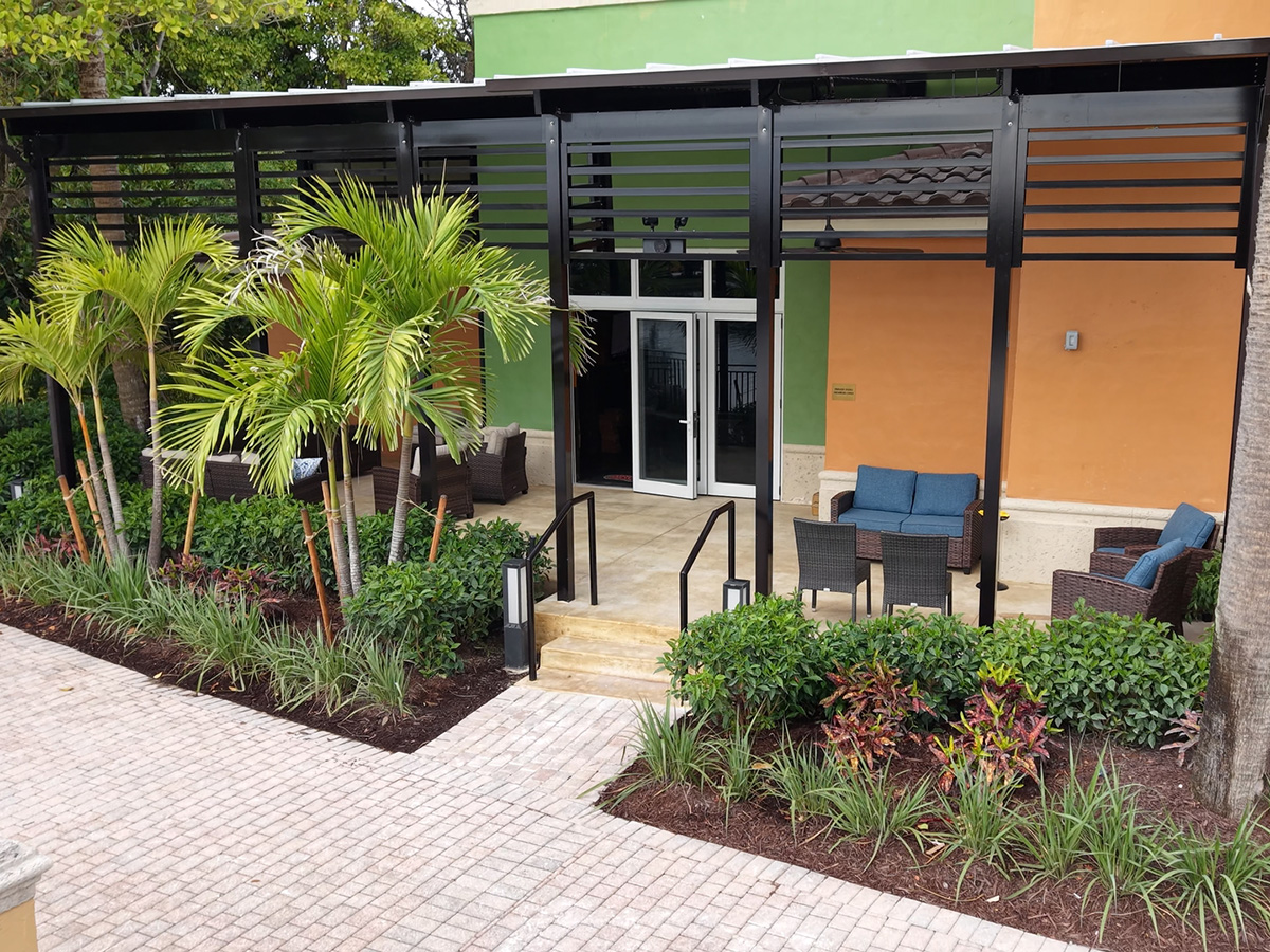 Finished pergola lounge with seating and landscaping