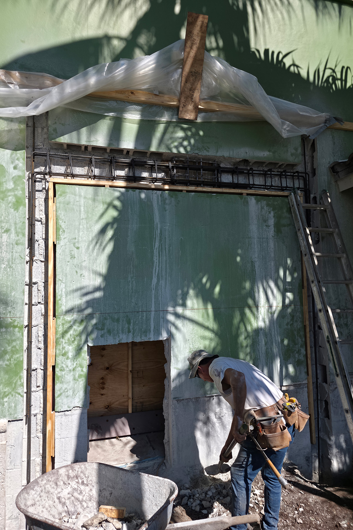 Cutting the opening through the concrete block wall