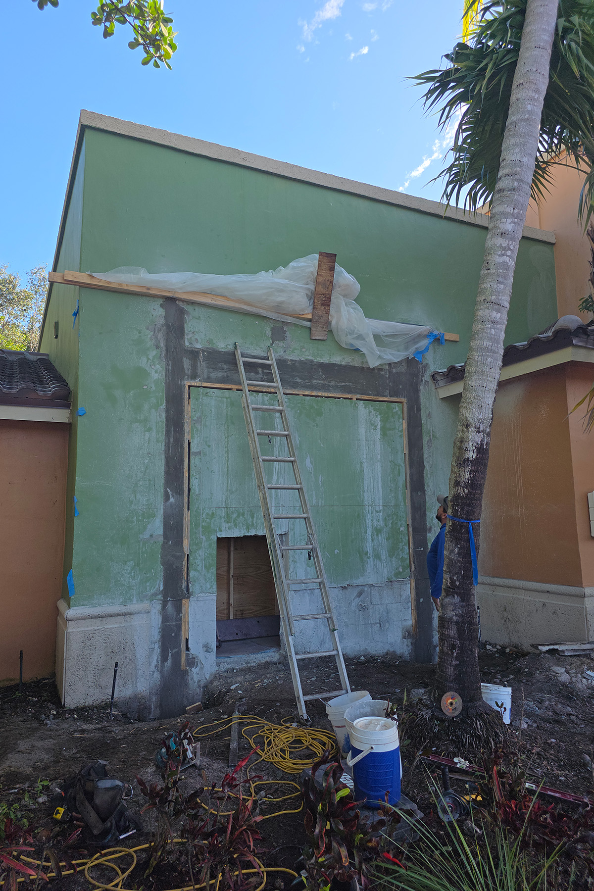 Poured concrete columns and header around the new opening