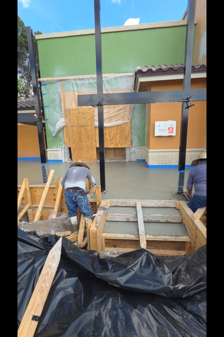 Concrete slab pour with pergola steel posts standing